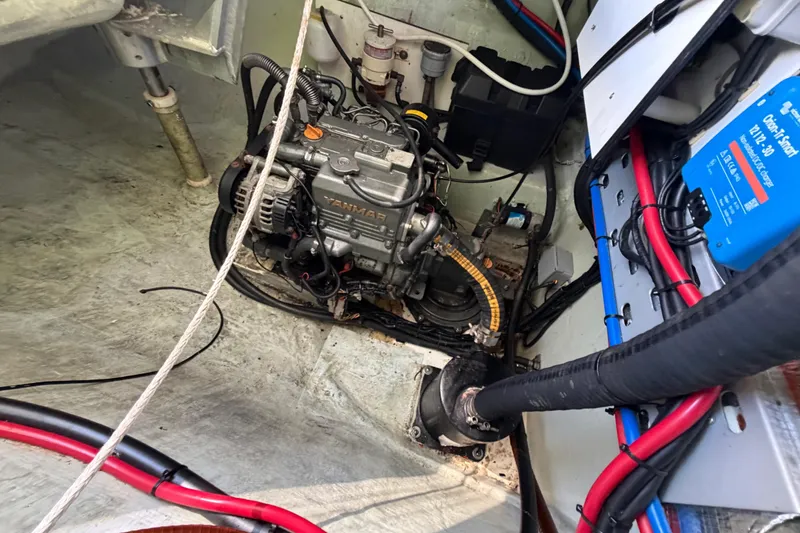 Slide: The Image of Engine compartment of a 2017 Leopard 40 catamaran with visible wiring and components. - 118