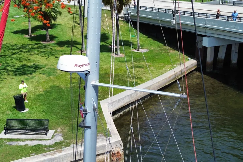 Slide: The Image of Mast of 2017 Leopard 40 catamaran near a park and bridge, featuring Raymarine equipment. - 120