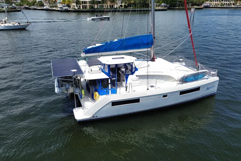 Slide: The Image of 2017 Leopard 40 catamaran sailing on calm waters near a coastal area. - 29