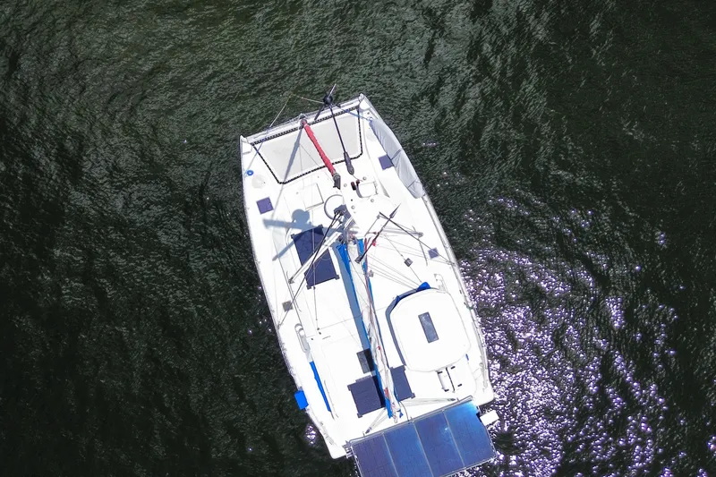 Slide: The Image of Aerial view of 2017 Leopard 40 catamaran sailing on dark water. - 35