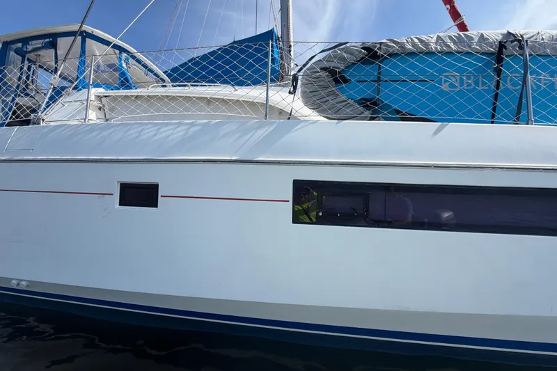 Slide: The Image of 2017 Leopard 40 catamaran side view with netting and blue accents. - 42