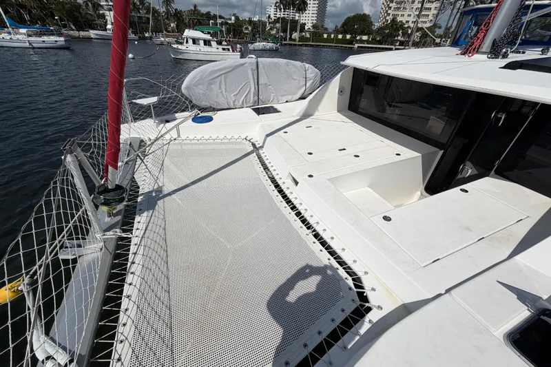 Slide: The Image of 2017 Leopard 40 catamaran deck with netting, docked in a marina. - 55
