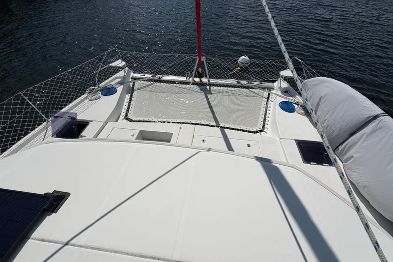 Slide: The Image of 2017 Leopard 40 catamaran deck with netting and ropes on calm water. - 61