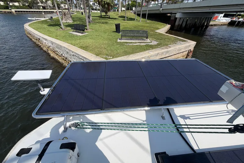 Slide: The Image of Solar panel on 2017 Leopard 40 catamaran near a scenic waterfront park. - 72