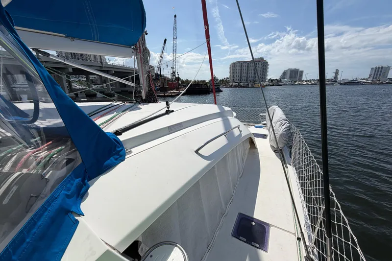 Slide: The Image of 2017 Leopard 40 catamaran docked in a marina with cityscape background. - 73