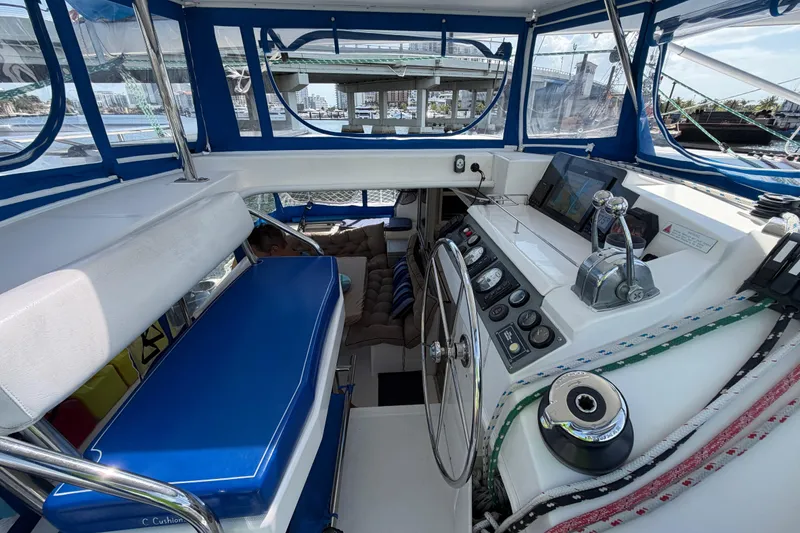 Slide: The Image of Cockpit of a 2017 Leopard 40 catamaran with navigation controls and seating. - 74