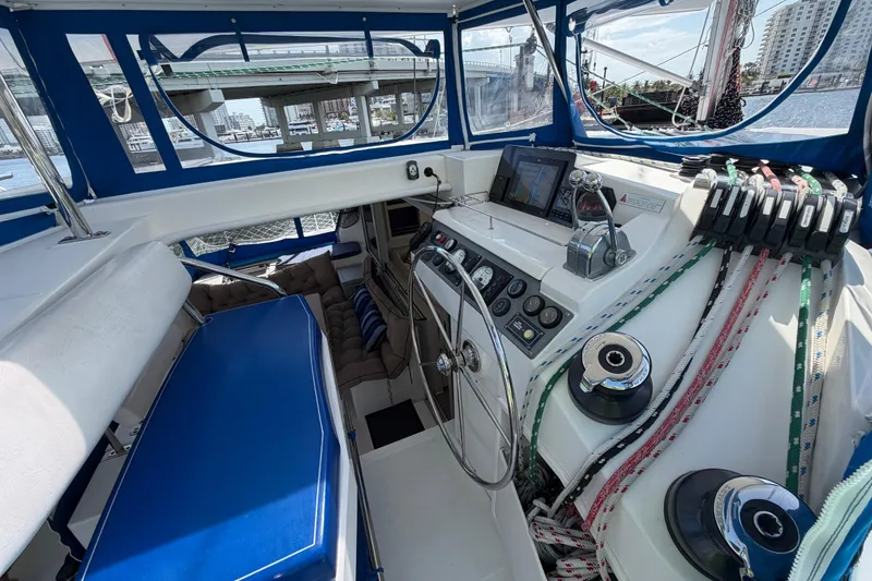Slide: The Image of Interior view of 2017 Leopard 40 catamaran cockpit with navigation controls and seating. - 75