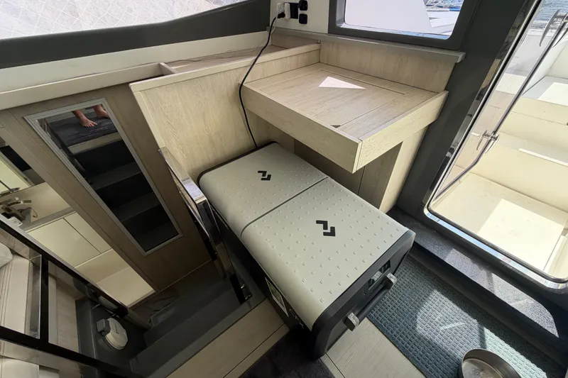 Slide: The Image of Interior of a 2017 Leopard 40 yacht with compact desk and storage area. - 93