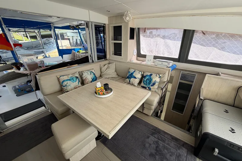 Slide: The Image of Luxurious interior of a 2017 Leopard 40 catamaran with cozy seating and nautical decor. - 95