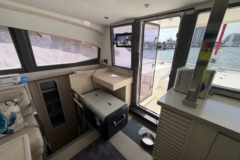 Slide: The Image of Interior of a 2017 Leopard 40 catamaran with modern furnishings and ocean view. - 96