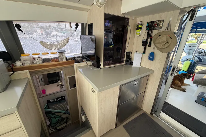 Slide: The Image of Interior of a 2017 Leopard 40 catamaran with kitchen and storage area. - 97