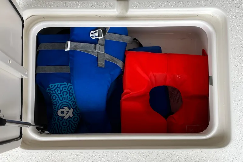 Slide: The Image of Storage compartment in 2024 Sea Chaser 21 LX boat with life jackets. - 11