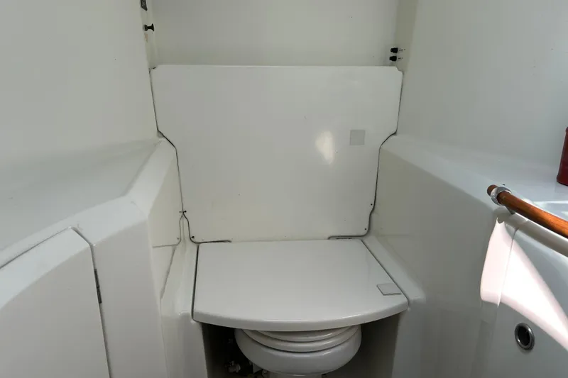 Slide: The Image of Interior view of 2000 Beneteau Oceanis Clipper 411 yacht bathroom with closed toilet lid. - 24