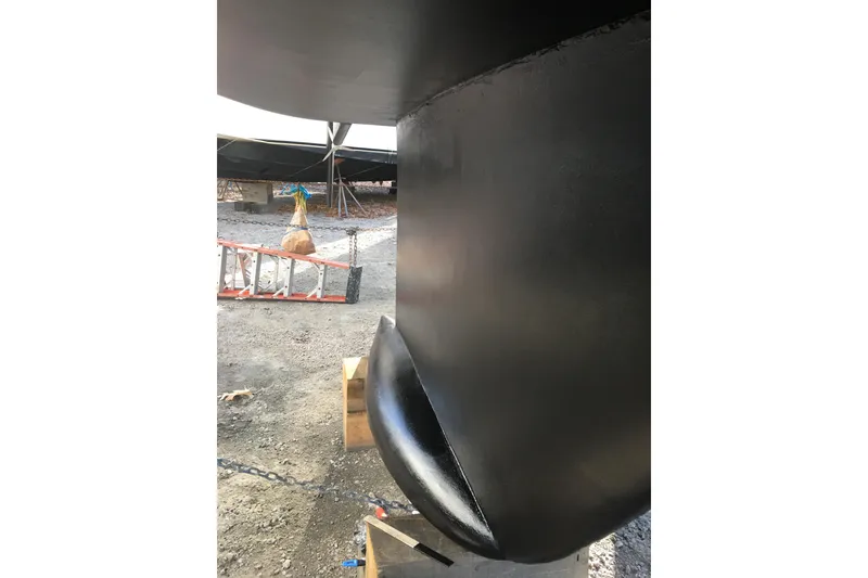 Slide: The Image of Bottom view of a 2000 Beneteau Oceanis Clipper 411 keel in a boatyard. - 12