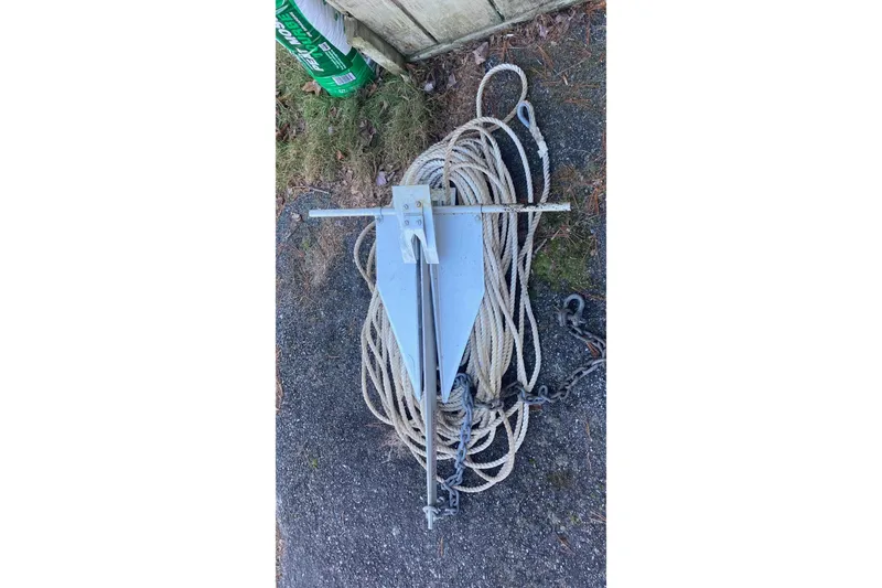 Slide: The Image of Anchor and rope for 2000 Beneteau Oceanis Clipper 411 on pavement. - 14