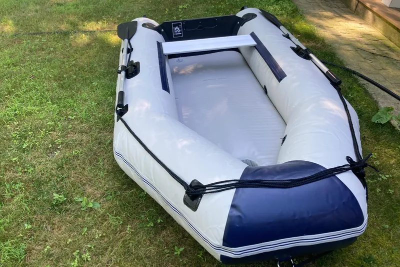 Slide: The Image of Inflatable dinghy on grass, associated with a 2000 Beneteau Oceanis Clipper 411 yacht. - 15