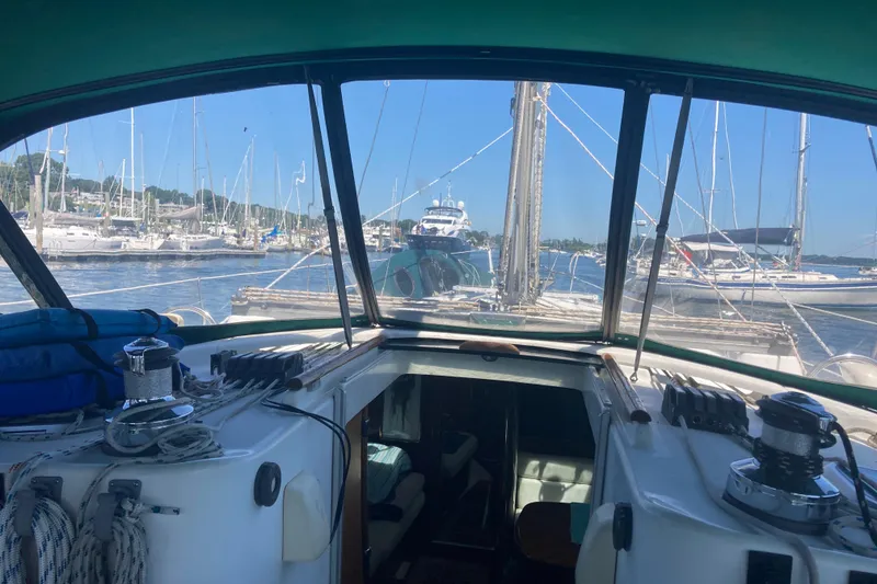 Slide: The Image of Cockpit view from a 2000 Beneteau Oceanis Clipper 411 sailboat in a marina. - 3