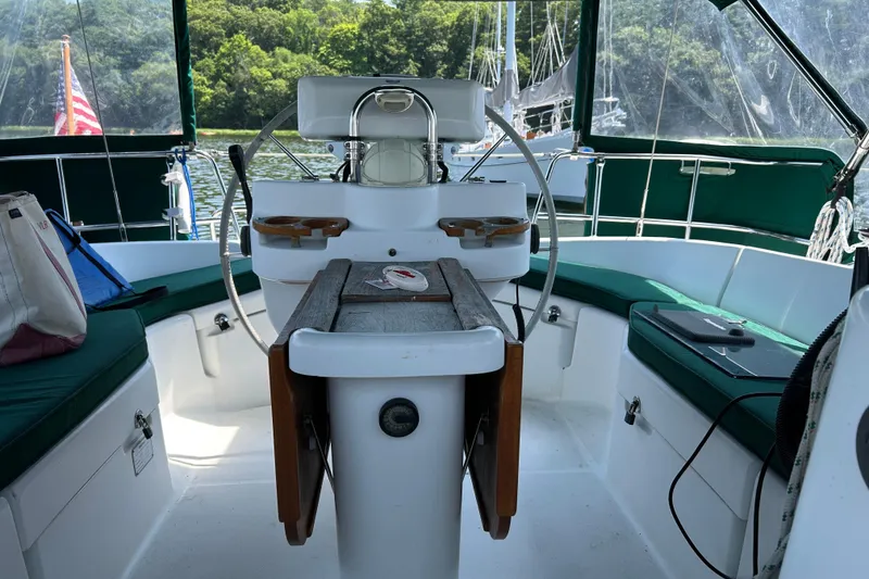 Slide: The Image of Cockpit of 2000 Beneteau Oceanis Clipper 411 sailboat with green seating and steering wheel. - 39
