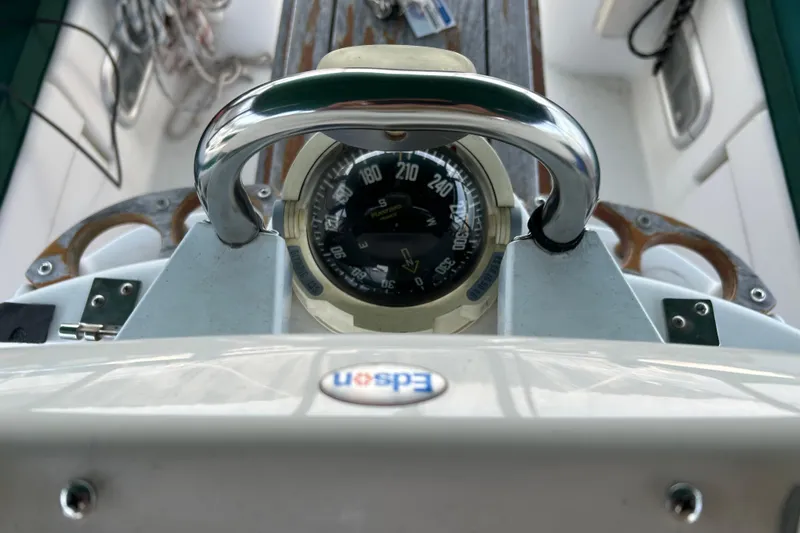 Slide: The Image of Compass on Beneteau Oceanis Clipper 411 yacht, 2000 model, with chrome handle and navigation instruments. - 44