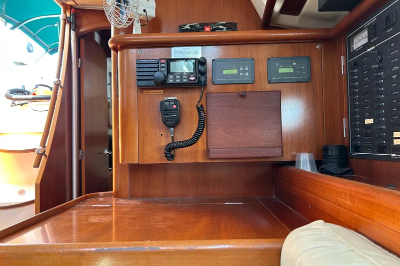 Slide: The Image of Interior view of a 2000 Beneteau Oceanis Clipper 411 yacht's navigation station. - 25