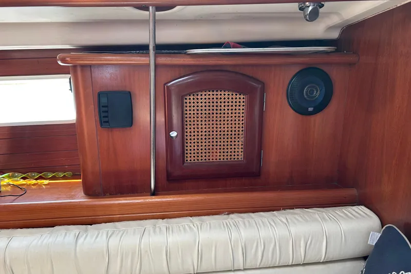 Slide: The Image of Interior of 2000 Beneteau Oceanis Clipper 411 yacht with wooden cabinetry and speaker. - 29