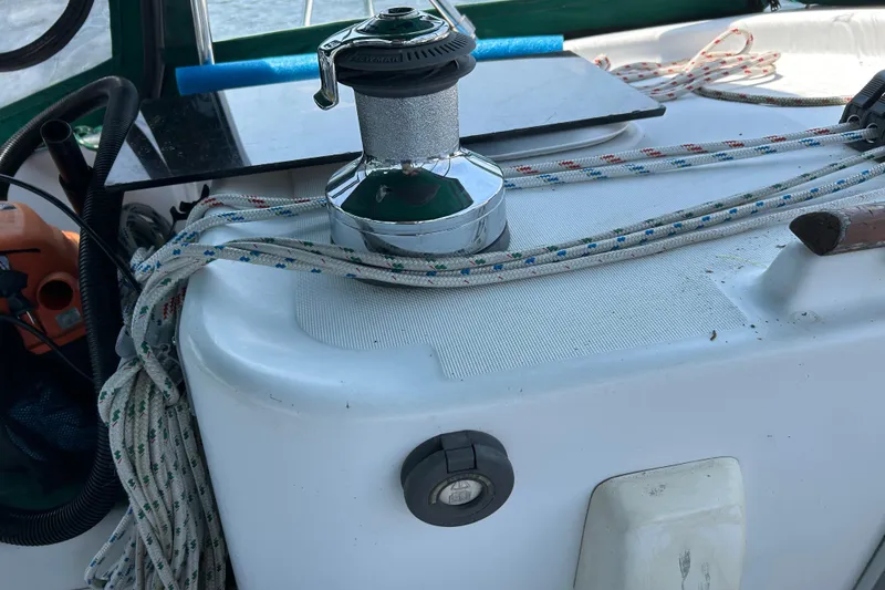 Slide: The Image of Winch and ropes on a 2000 Beneteau Oceanis Clipper 411 sailboat deck. - 41