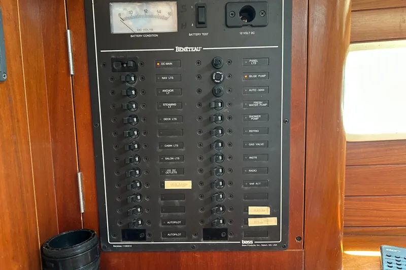 Slide: The Image of Electrical panel of a 2000 Beneteau Oceanis Clipper 411 sailboat, featuring various switches and gauges. - 26