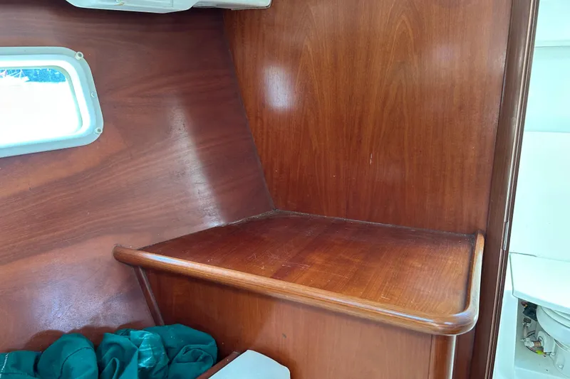 Slide: The Image of Interior of 2000 Beneteau Oceanis Clipper 411 yacht with wooden finish and window. - 33
