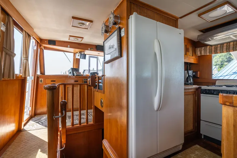 Slide: The Image of Interior of a 1976 Grand Banks 52 Europa yacht with kitchen. - 11