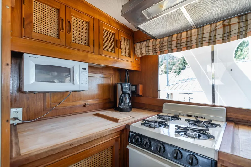 Slide: The Image of Kitchen area on 1976 Grand Banks 52 Europa yacht. - 13