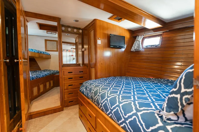 Slide: The Image of Interior of 1976 Grand Banks 52 Europa yacht with wood finish and bed. - 16