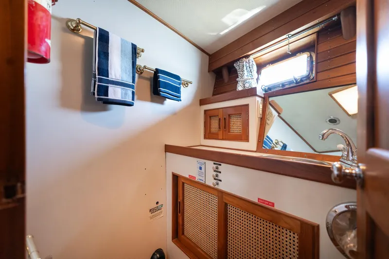 Slide: The Image of Interior of 1976 Grand Banks 52 Europa yacht, bathroom with towels and wood paneling. - 20