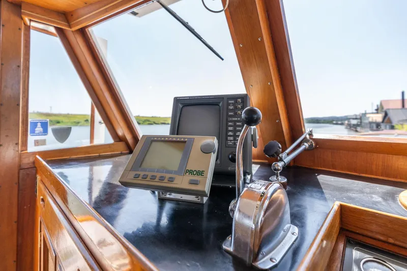 Slide: The Image of 1976 Grand Banks 52 Europa helm with navigation equipment. - 37