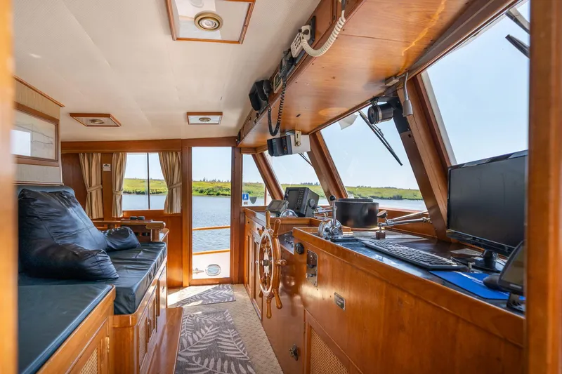 Slide: The Image of Interior of a 1976 Grand Banks 52 Europa yacht with wooden furnishings. - 42