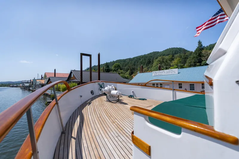 Slide: The Image of Deck of 1976 Grand Banks 52 Europa yacht overlooking water and shoreline. - 45