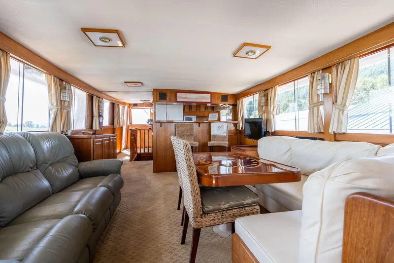 Slide: The Image of Interior of a 1976 Grand Banks 52 Europa yacht, featuring elegant furnishings. - 5