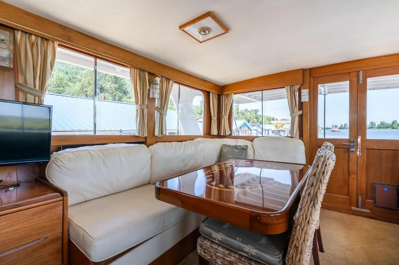 Slide: The Image of Interior of 1976 Grand Banks 52 Europa yacht with cozy seating area. - 6