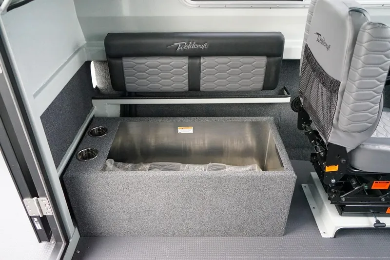 Slide: The Image of Interior of 2026 Weldcraft 260 Ocean King boat with seating and storage compartment. - 12