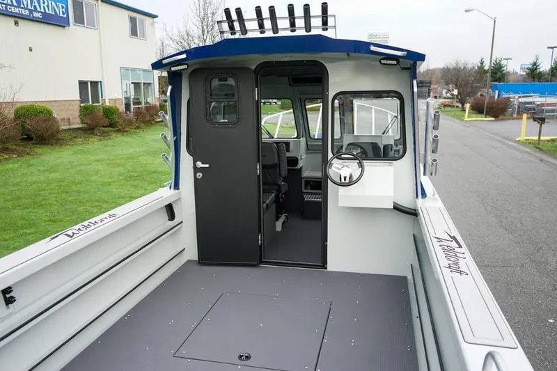 Slide: The Image of 2026 Weldcraft 260 Ocean King boat interior, featuring spacious deck and modern helm. - 20