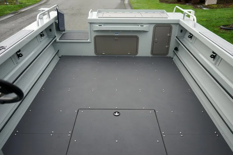 Slide: The Image of 2026 Weldcraft 260 Ocean King boat interior with spacious deck and storage compartments. - 21