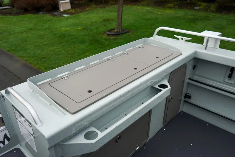 Slide: The Image of 2026 Weldcraft 260 Ocean King boat deck with storage compartments and railing. - 22