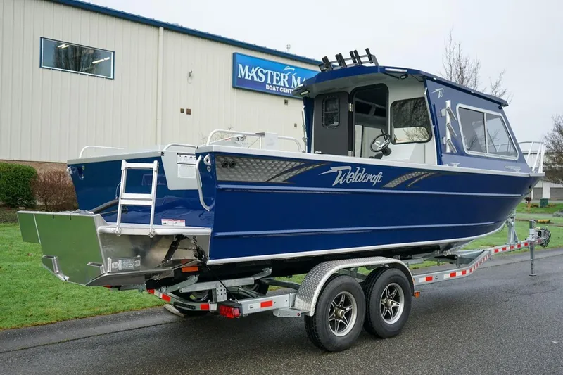 Slide: The Image of 2026 Weldcraft 260 Ocean King boat on trailer outside Master Marine building. - 4
