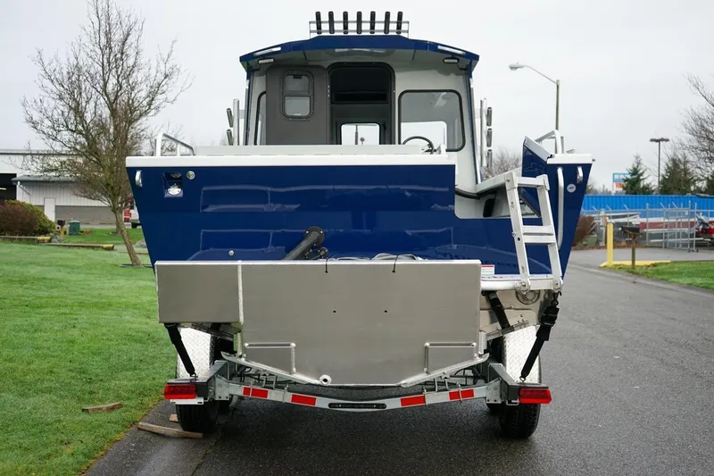 Slide: The Image of 2026 Weldcraft 260 Ocean King boat on trailer, rear view, parked outdoors. - 5