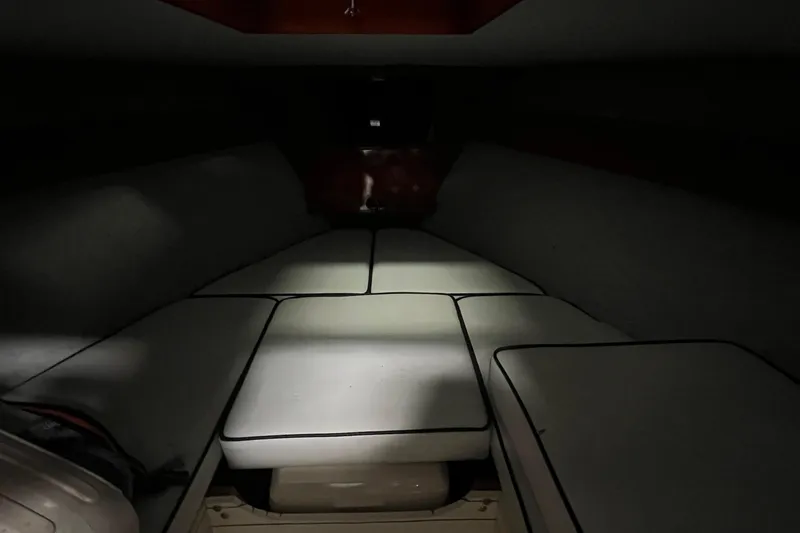 Slide: The Image of Interior cabin of a 2006 Skiff Craft 24' Runabout with cushioned seating. - 16
