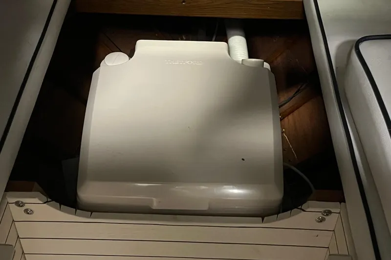 Slide: The Image of 2006 Skiff Craft 24' Runabout interior with a built-in appliance. - 17