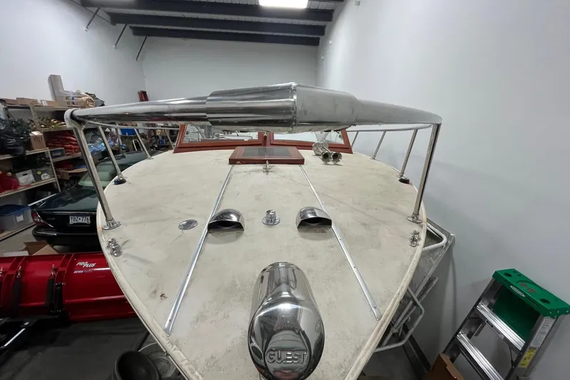 Slide: The Image of 2006 Skiff Craft 24' Runabout boat in a storage facility. - 4