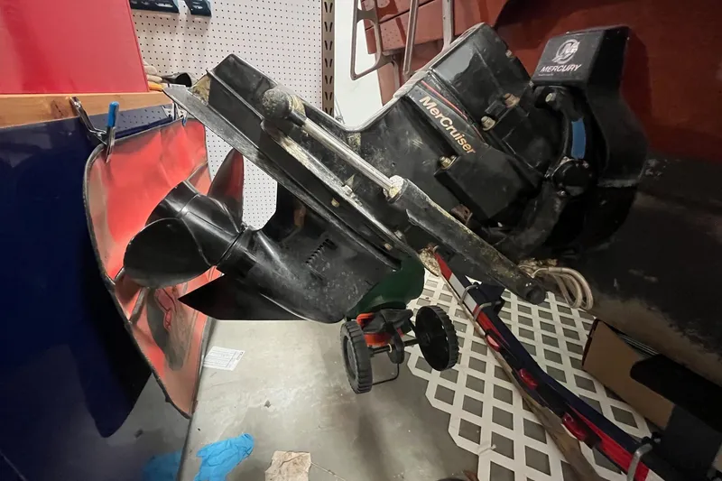 Slide: The Image of 2006 Skiff Craft 24' Runabout with MerCruiser engine in a garage setting. - 9