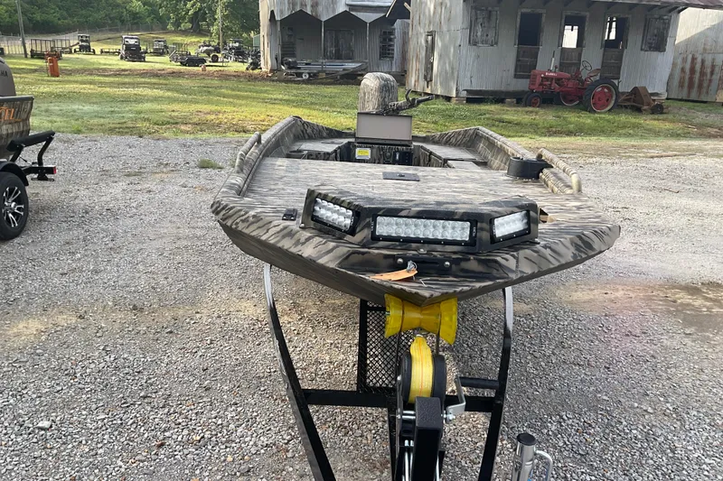 Slide: The Image of 2026 Excel 1751 Viper F4 boat with camouflage design and LED lights on trailer. - 9