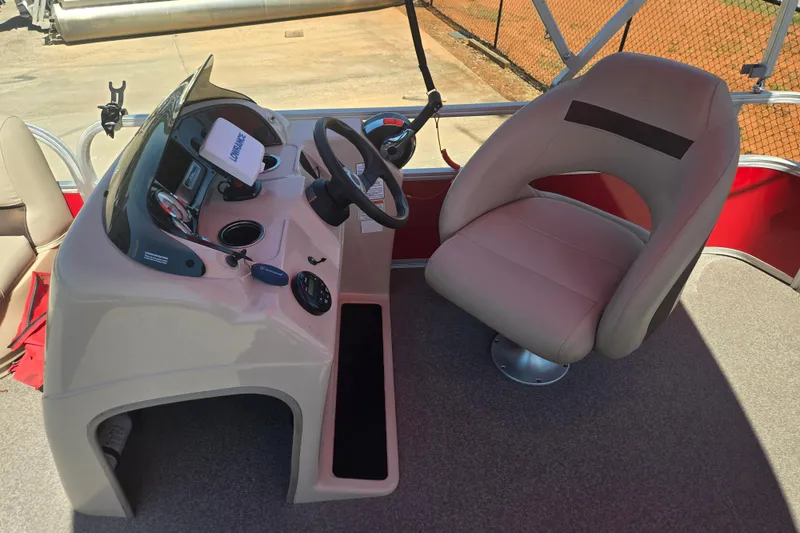 Slide: The Image of 2017 Sun Tracker Party Barge 18 DLX helm with steering wheel and captain's chair. - 13