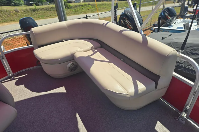 Slide: The Image of 2017 Sun Tracker Party Barge 18 DLX with beige seating and outdoor setting. - 14